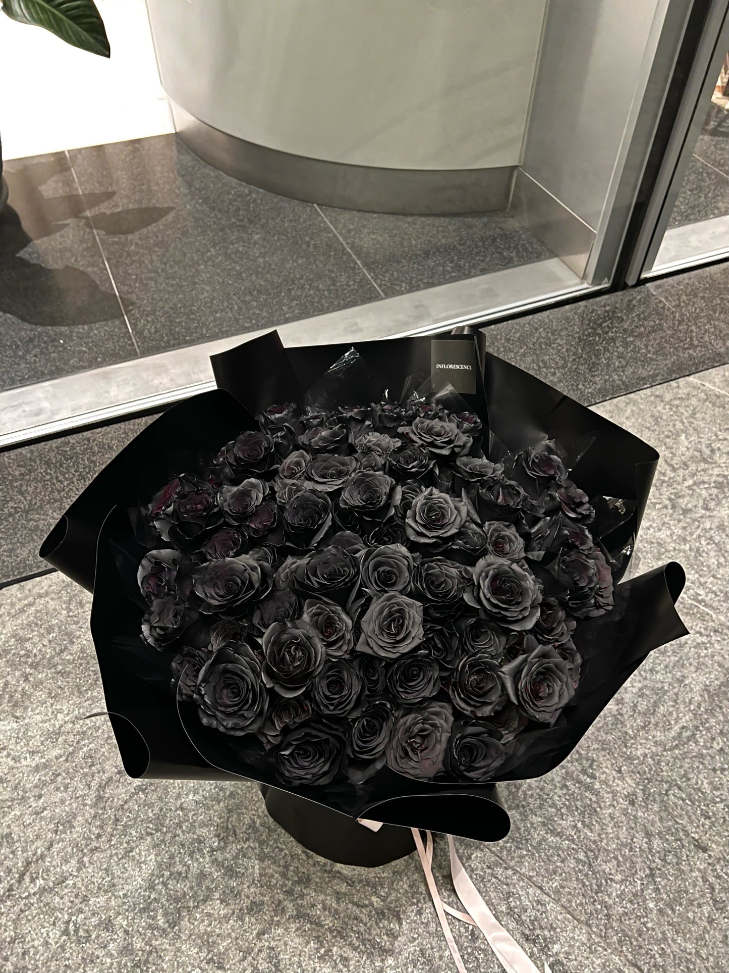 Luxurious bouquet of 99 black roses, hand-arranged to symbolize eternal love and devotion, the perfect statement of romance and passion.