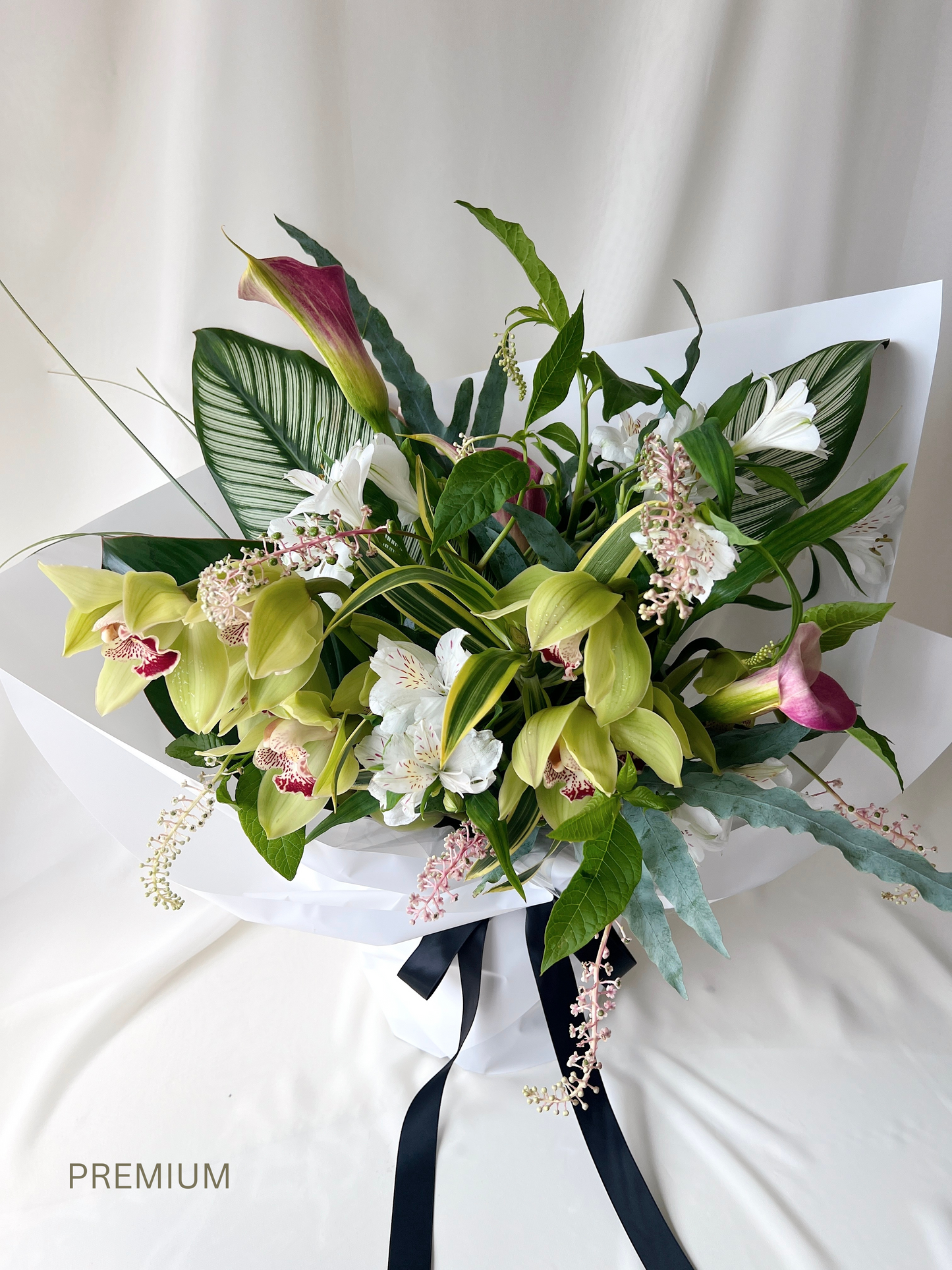 Seasonal green florist’s choice bouquet with lush foliage and organic textures by Studio Inflorescence