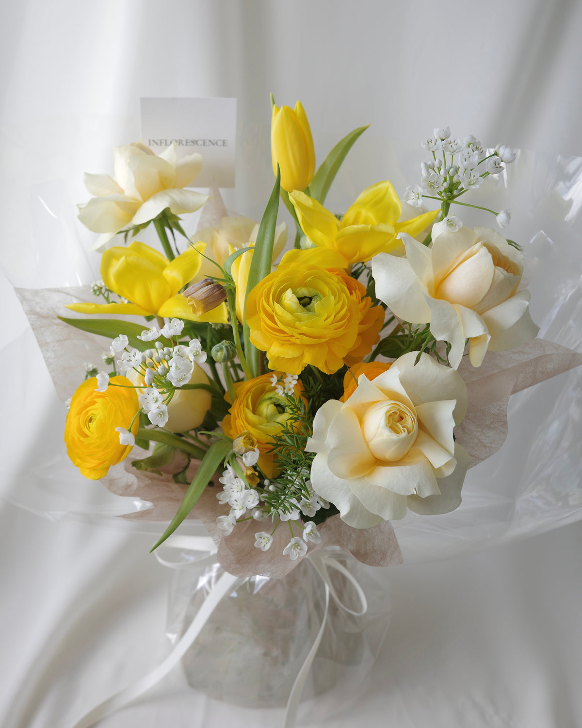 Premium yellow and white bouquet with tulips, roses, mimosa, and seasonal flowers by Studio Inflorescence Singapore