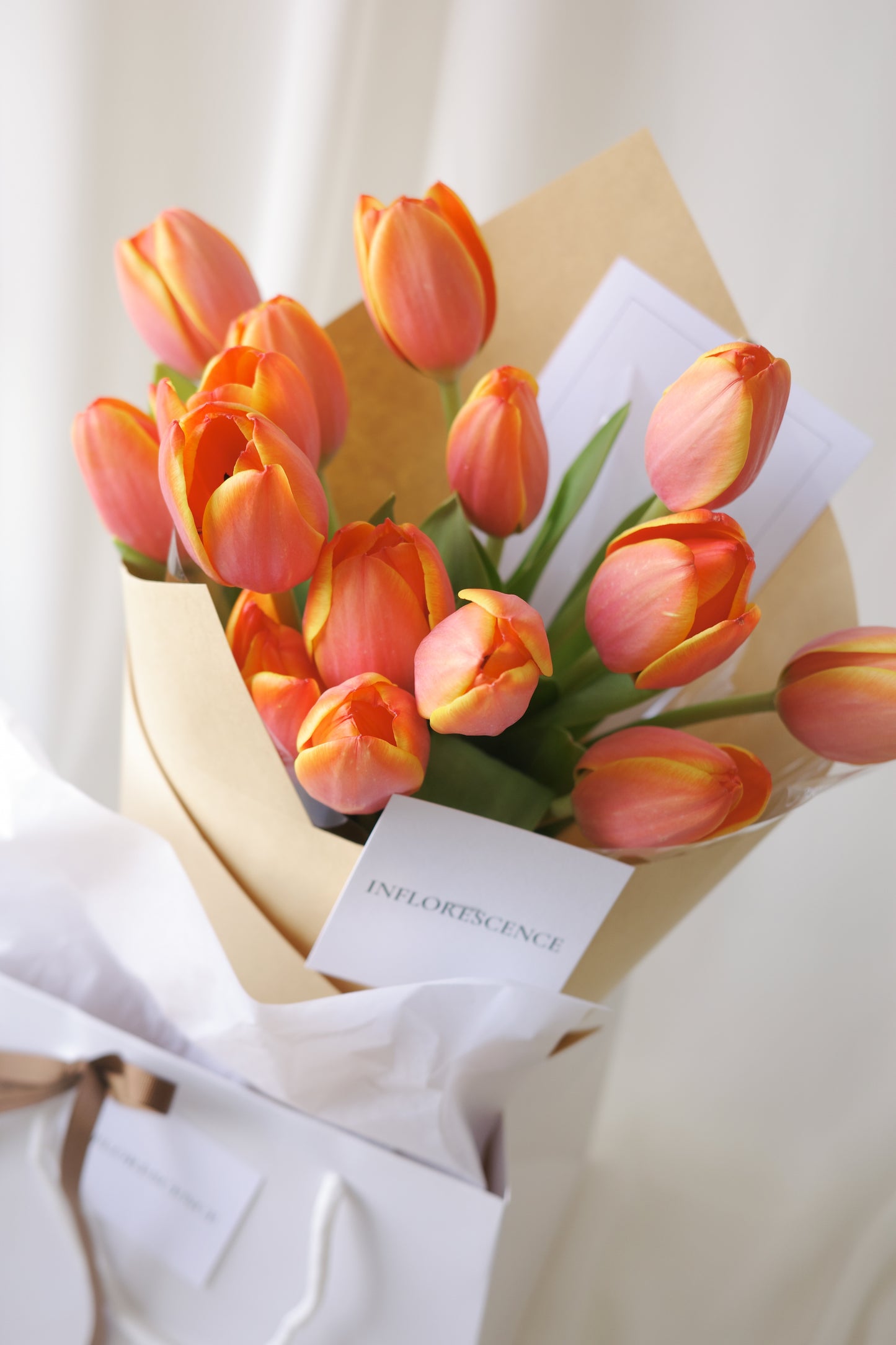 Fresh vibrant orange tulip bouquet arranged by Studio Inflorescence