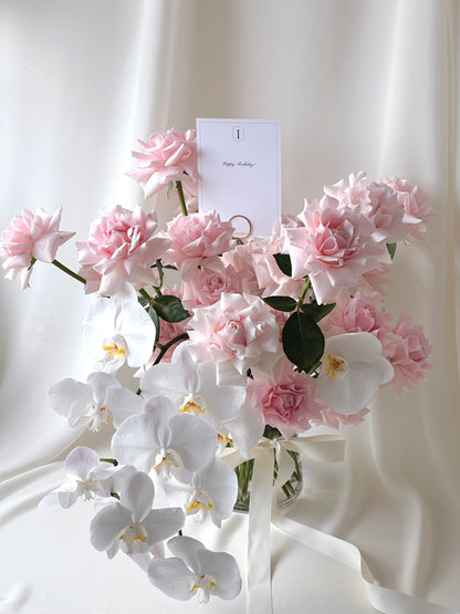 Rose Renaissance vase arrangement with blush pink roses and cascading white orchids.