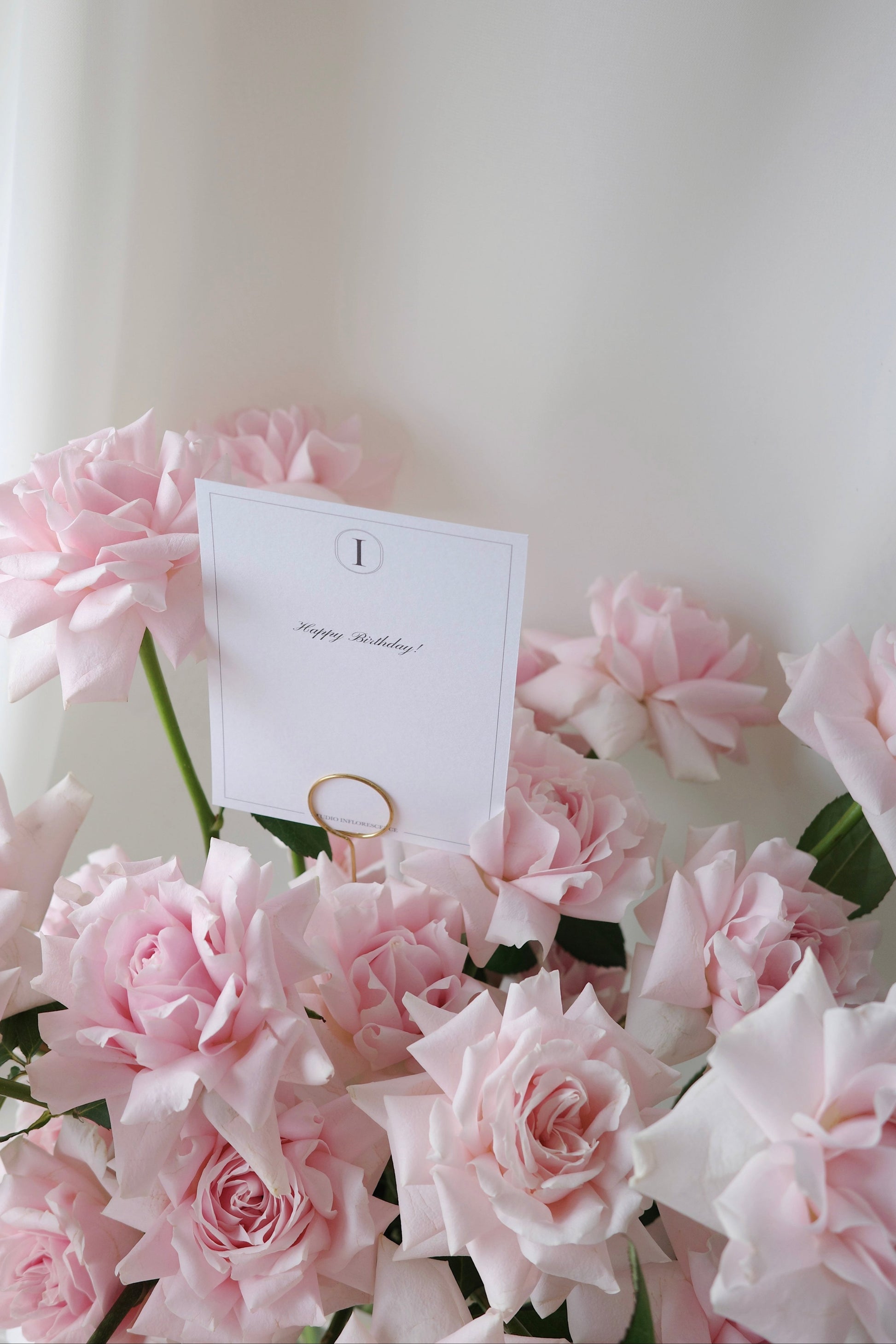 Rose Renaissance vase arrangement with blush pink roses and cascading white orchids.