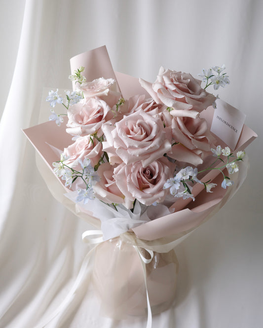 Romantic bouquet of nude pink roses and blue delphiniums by Studio Inflorescence Singapore