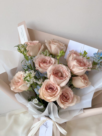 Romantic bouquet of nude pink roses and blue delphiniums by Studio Inflorescence Singapore
