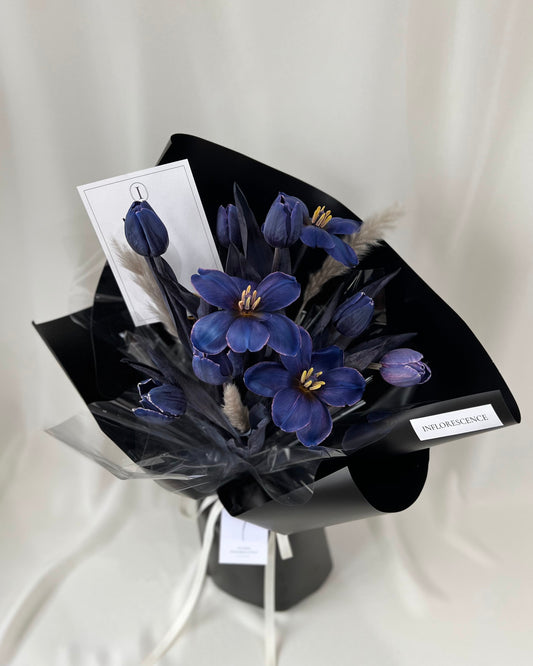 Deep blue tulip bouquet in a sculptural wrapped arrangement by Studio Inflorescence Singapore