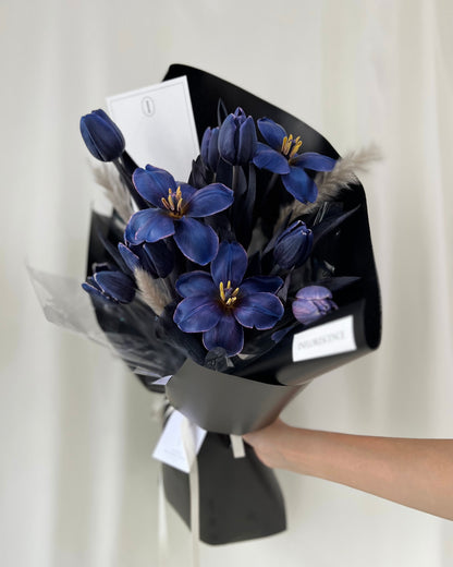 Deep blue tulip bouquet in a sculptural wrapped arrangement by Studio Inflorescence Singapore