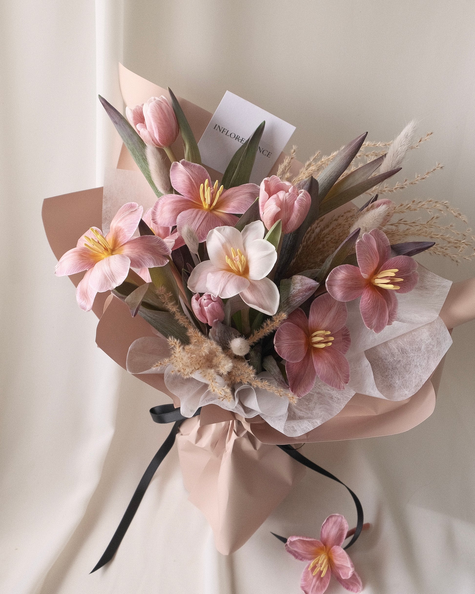 Brownie tulip bouquet with soft blush flowers and seasonal textures by Studio Inflorescence Singapore