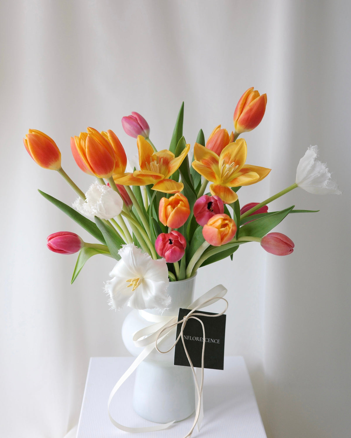 Dance of the Tulips vase arrangement with fresh tulips in a lively composition