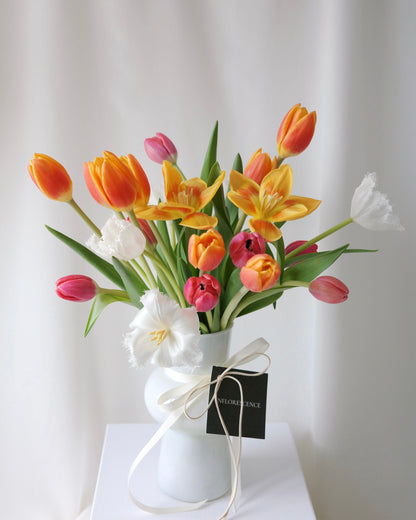 Dance of the Tulips vase arrangement with fresh tulips in a lively composition