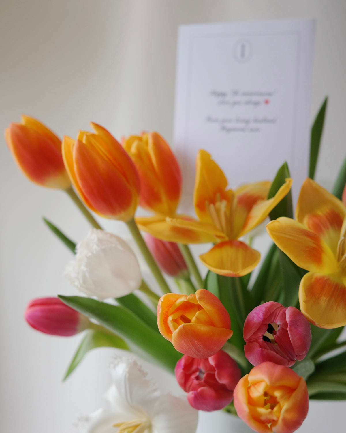 Close-up of fresh tulips naturally bending and curving in Dance of the Tulips vase arrangement