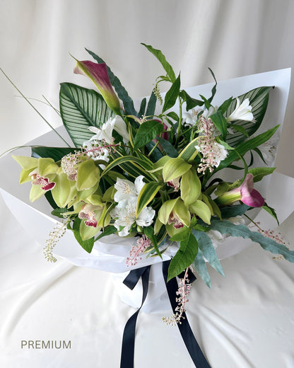 Green botanical bouquet with lush foliage, sculptural branches, and fresh seasonal flowers by Studio Inflorescence Singapore