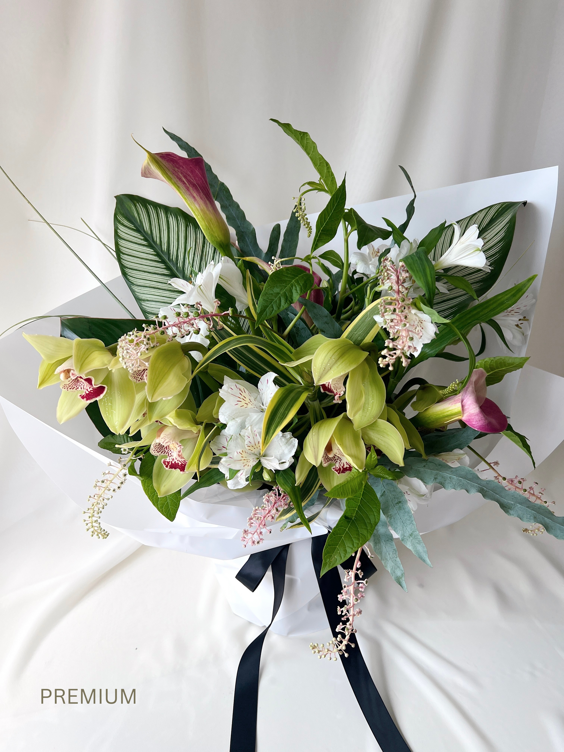 Seasonal green florist’s choice bouquet with lush foliage and organic textures by Studio Inflorescence