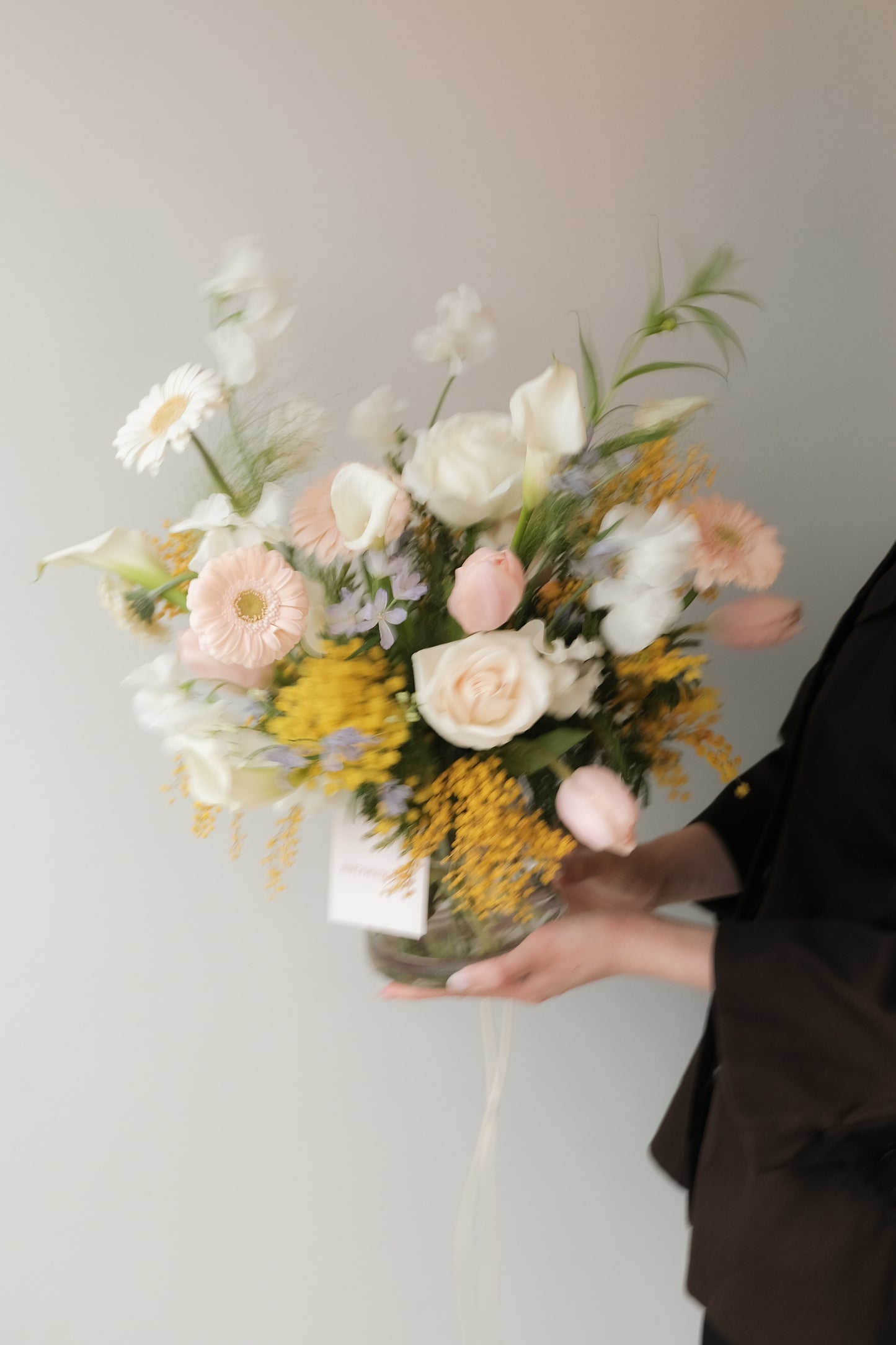 Valentine's Day. Soft blush and ivory floral arrangement with natural movement in a vase, Gentle Assembly