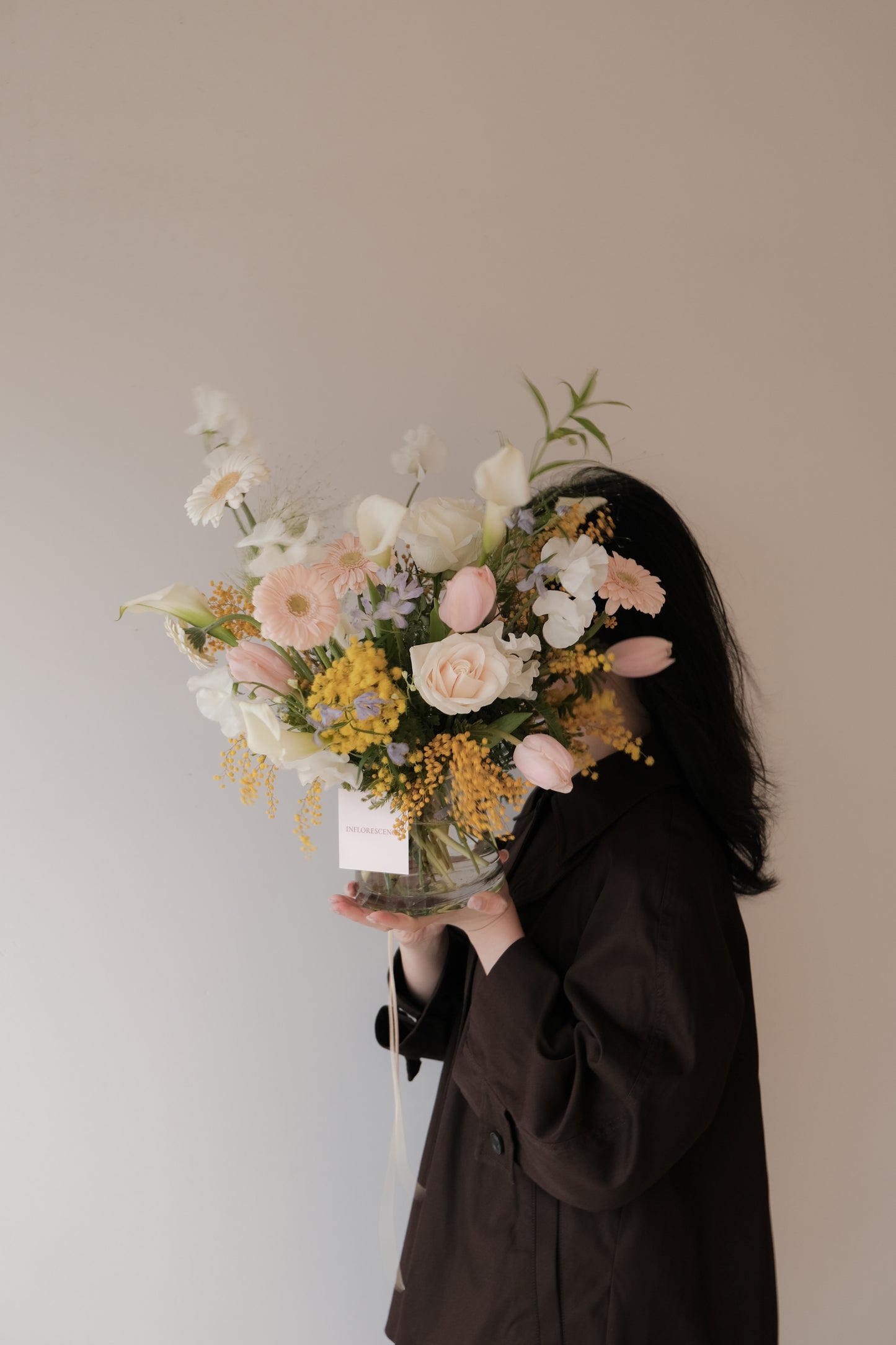 Valentine's Day. Soft blush and ivory floral arrangement with natural movement in a vase, Gentle Assembly