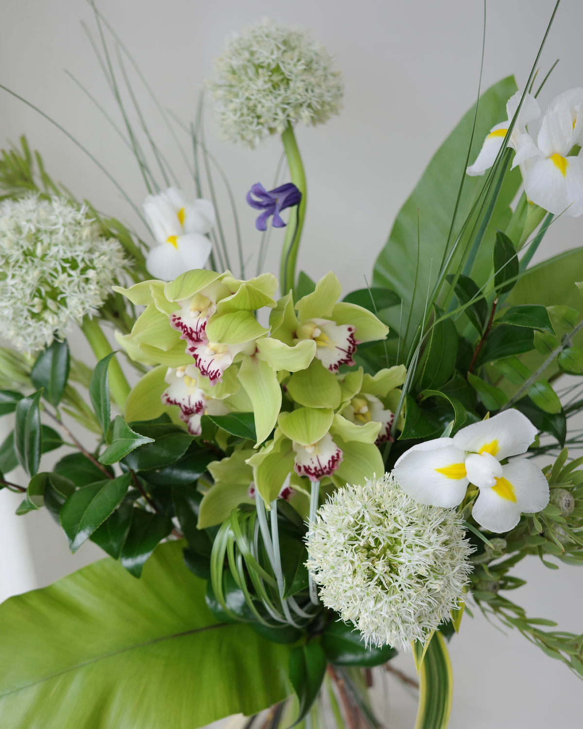 Green botanical bouquet with lush foliage, sculptural branches, and fresh seasonal flowers by Studio Inflorescence Singapore