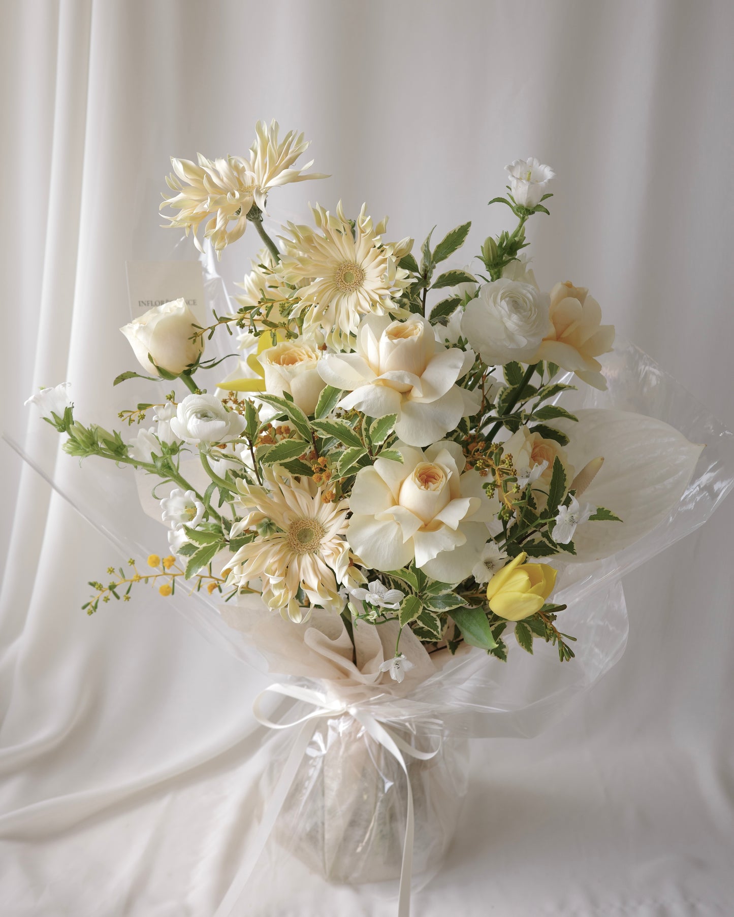 Premium yellow and white bouquet with tulips, roses, mimosa, and seasonal flowers by Studio Inflorescence Singapore