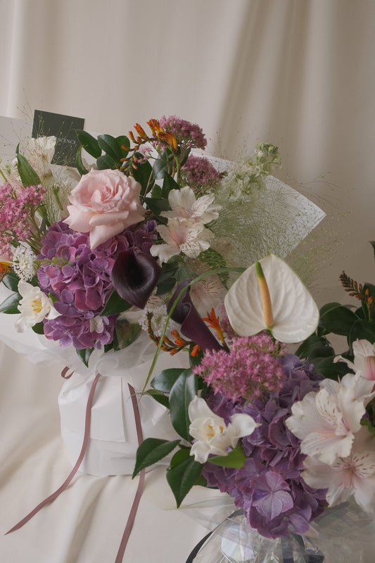 A full, romantic seasonal bouquet with layered blooms in soft tones, Lover by Studio Inflorescence
