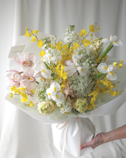 Seasonal bouquet in blush pink, butter yellow, white, and green by Studio Inflorescence Singapore