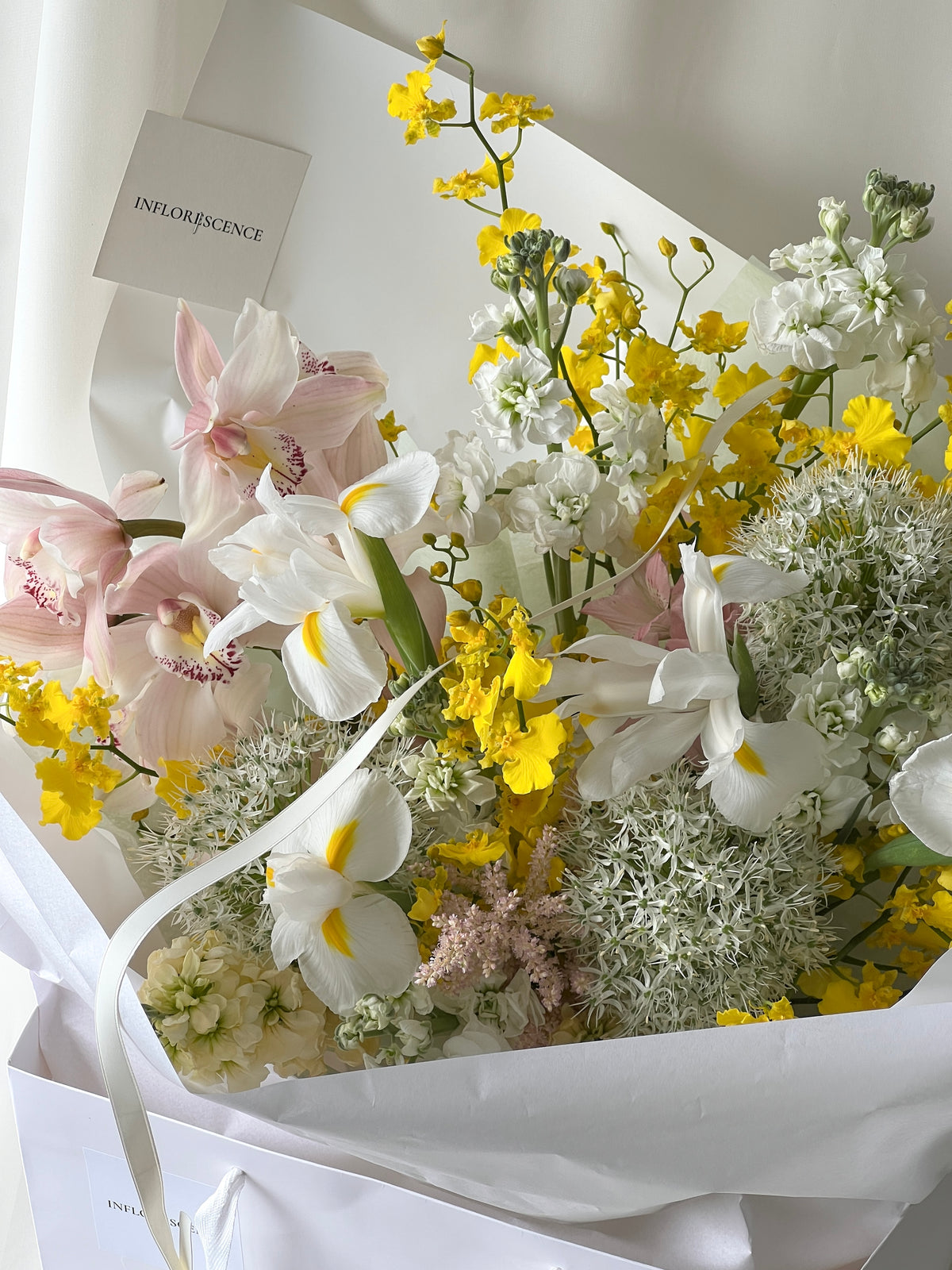 Seasonal bouquet in blush pink, butter yellow, white, and green by Studio Inflorescence Singapore
