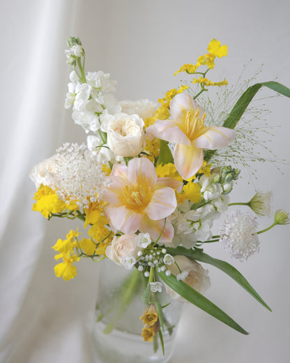 Seasonal bouquet in blush pink, butter yellow, white, and green by Studio Inflorescence Singapore